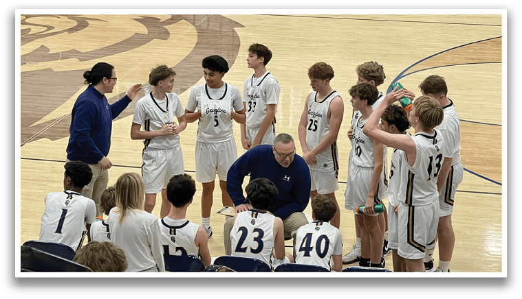 A group of young men are gathered on a basketball court, engaged in conversation with each other. AI generated content