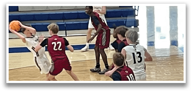 A group of young men playing basketball on a court. AI generated content