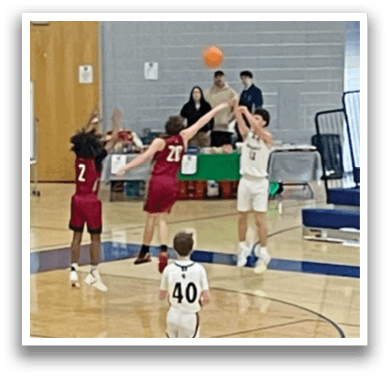 A group of people playing basketball in a gym. AI generated content