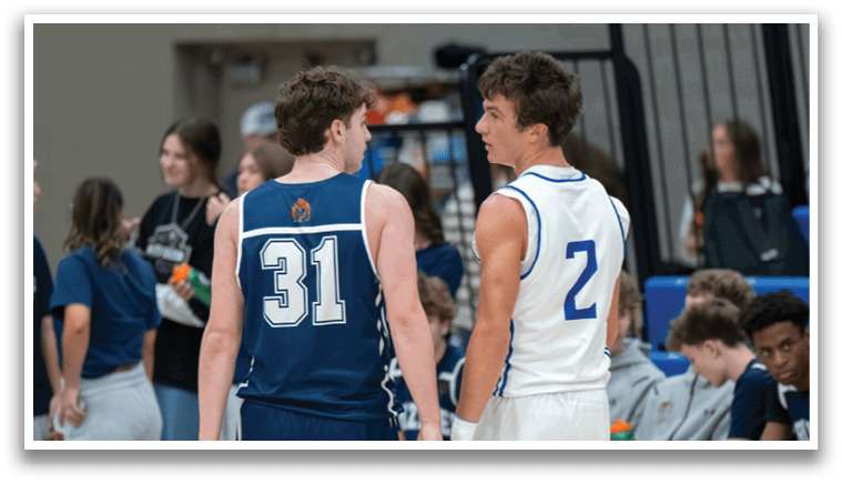 Two men wearing sports uniforms are walking on a basketball court. AI generated content
