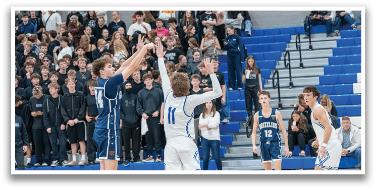 A group of people playing basketball, with one player jumping to block a shot. AI generated content