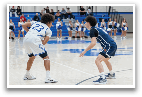 Two basketball players on a court, one wearing a blue jersey and the other wearing a black jersey. AI generated content