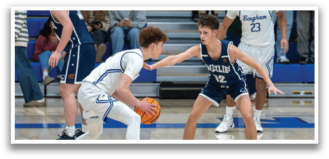 Two basketball players are playing for the ball, with one player trying to block the other. AI generated content