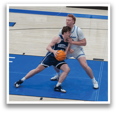 Two men playing basketball, one with a ball in his hand. AI generated content