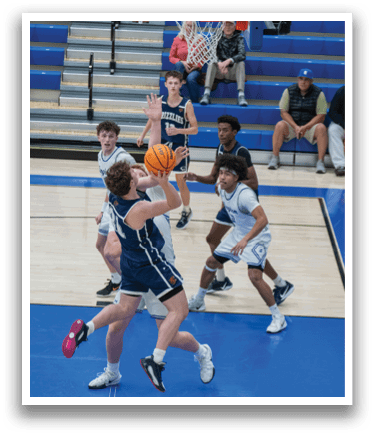 A group of young men playing basketball on a court. AI generated content