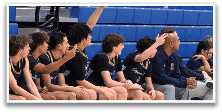 A group of young men are sitting on a blue bench, watching a basketball game. AI generated content