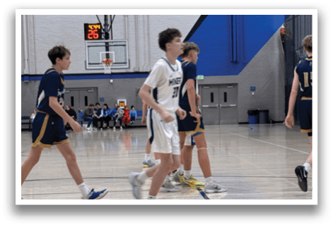 A group of young men playing basketball on a court. AI generated content