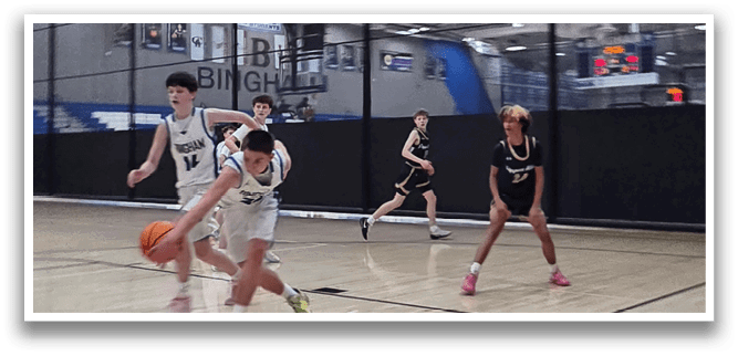 A group of young men playing basketball on a court. AI generated content
