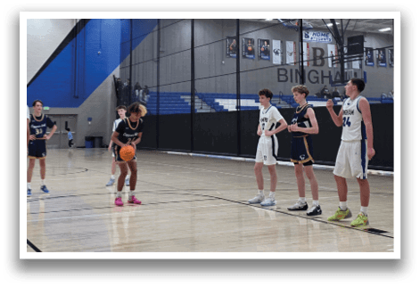 A group of young men playing basketball on a court. AI generated content
