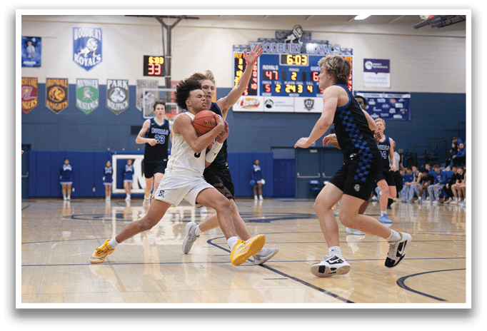A basketball game is in progress with players running up and down the court. One player is holding a basketball and appears to be running towards the basket. The other players are also running, trying to get to the basket. The game is being played in a gymnasium. AI generated content