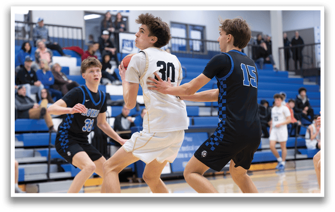 A group of young men playing basketball on a court. AI generated content