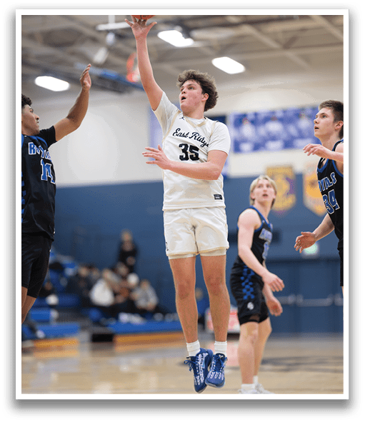 A basketball player leaps into the air to catch the ball. AI generated content