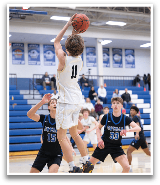 A basketball player leaps in the air to grab the ball. AI generated content