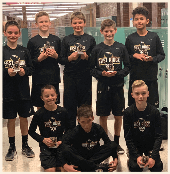 A group of young boys wearing black shirts and shorts pose for a picture. AI generated content