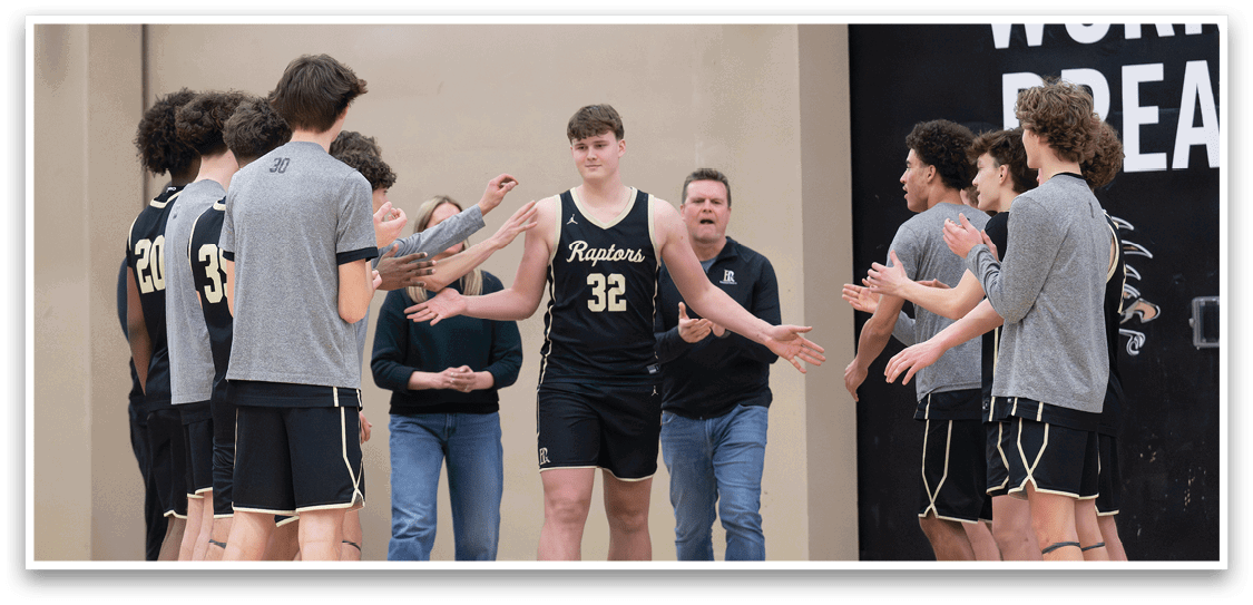 A group of young men in a gym, some wearing basketball uniforms, shake hands with each other. AI generated content