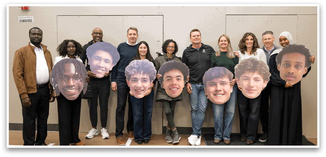A group of people are posing with cutouts of their faces. AI generated content
