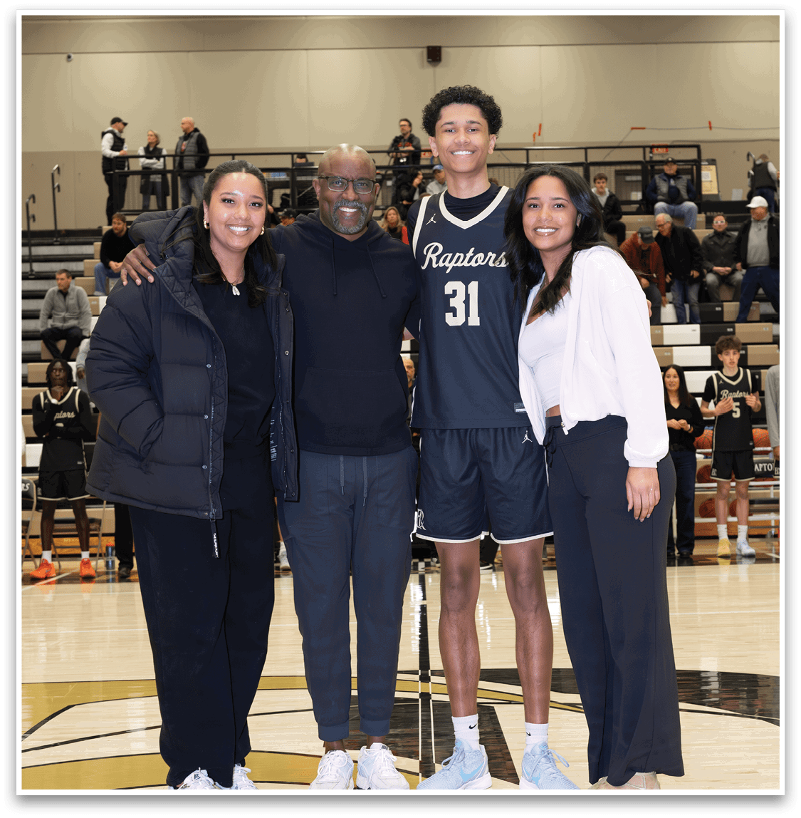 A group of people posing for a photo on a basketball court. AI generated content