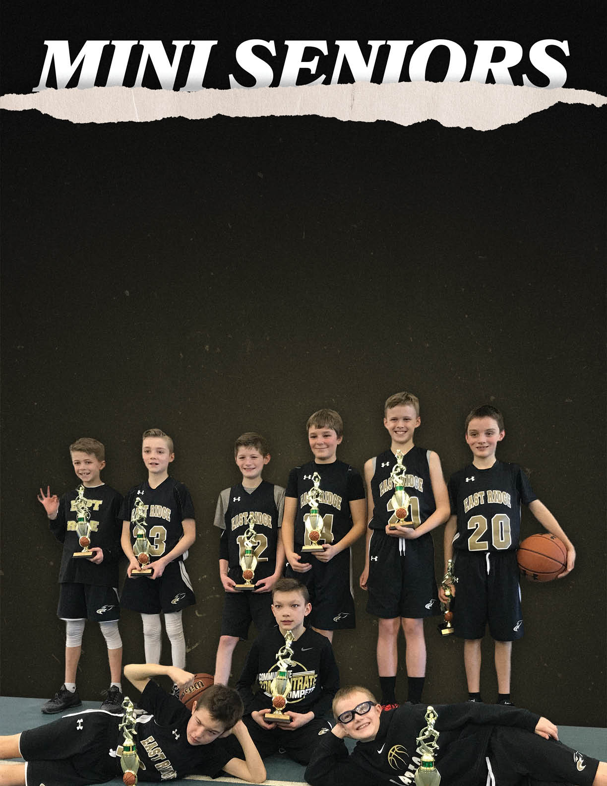 A group of young boys pose for a photo with trophies in their hands. AI generated content