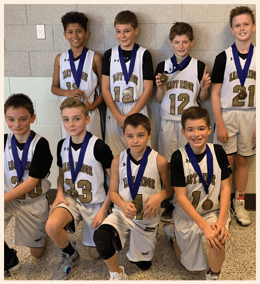 A group of young boys wearing basketball jerseys pose for a photo. AI generated content