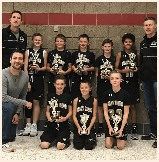 A group of young boys are holding trophies, posing for a picture. AI generated content