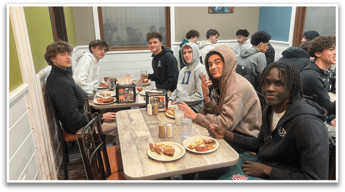 A group of people are sitting at a table in a restaurant, enjoying their meal. AI generated content