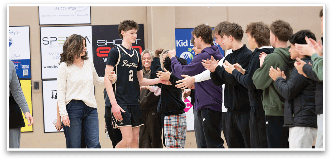 A group of people are clapping for a young man in a basketball uniform. AI generated content