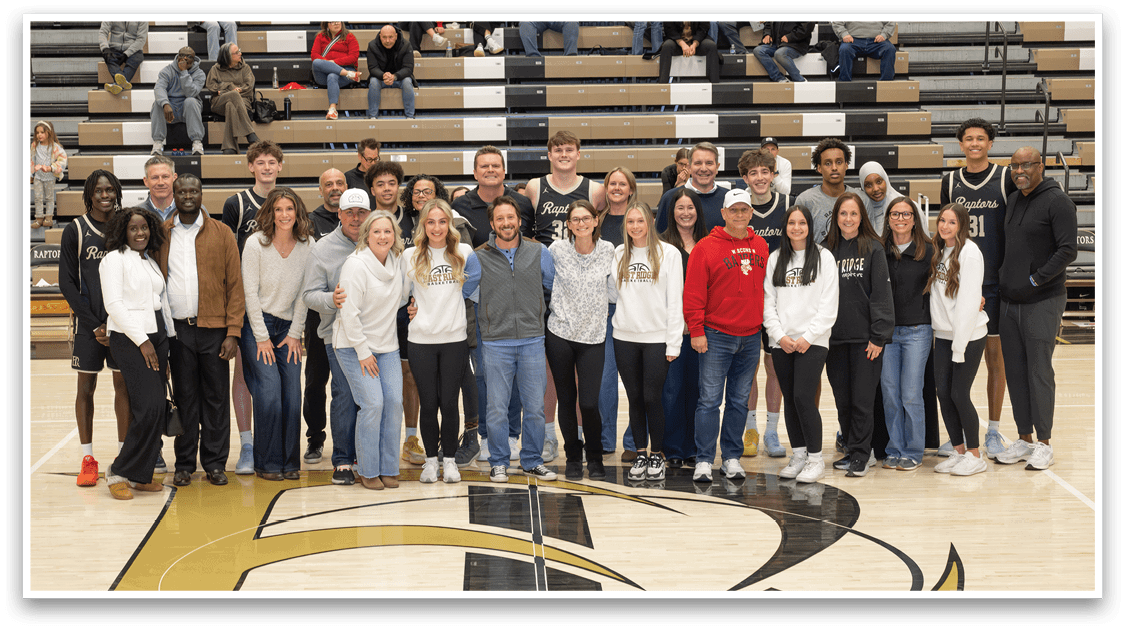 A group of people posing for a picture on a basketball court. AI generated content