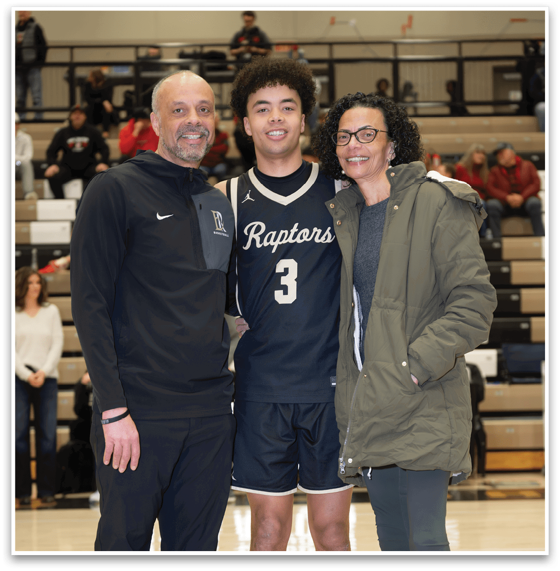 Three people pose for a photo on a basketball court. AI generated content