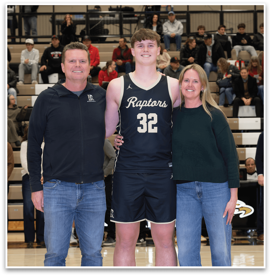 A man and a woman pose with a basketball player who is wearing a jersey with the number 32. AI generated content