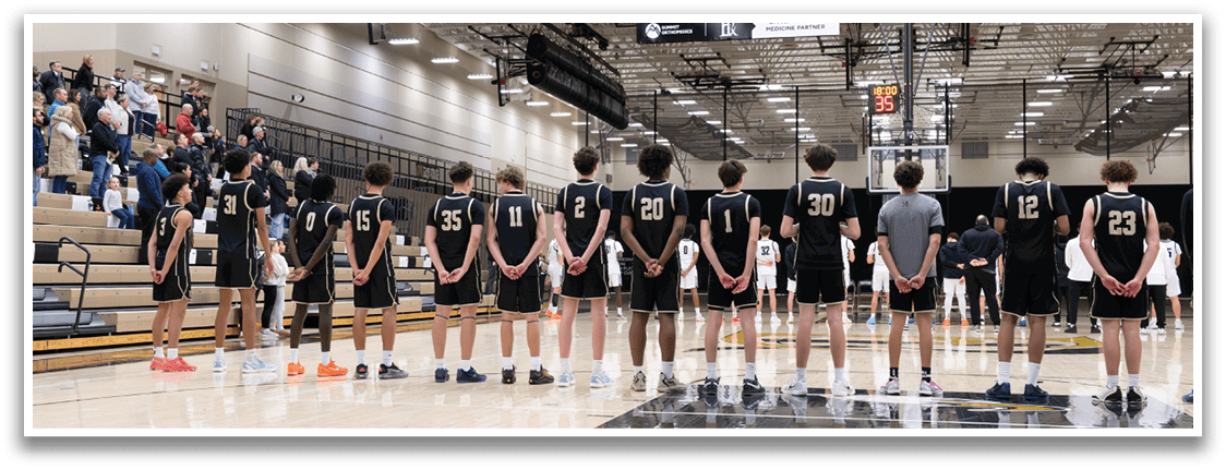 A group of basketball players are lined up on the court, wearing black uniforms. AI generated content
