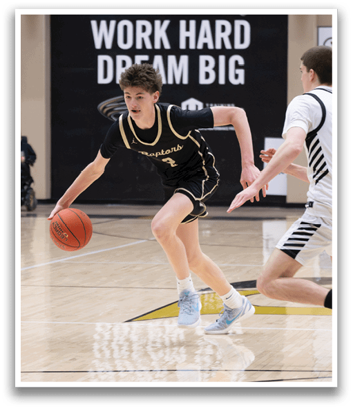 Two boys playing basketball on a court. One boy is holding a basketball and the other is running towards him. AI generated content