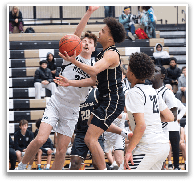A group of young men playing basketball, with one player attempting to block a shot. AI generated content