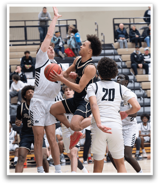 Basketball players on a court, one player is jumping to block a shot. AI generated content