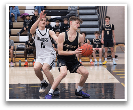 Two basketball players on a court, one wearing a white jersey and the other wearing a black jersey. The player in the white jersey is attempting to block the shot of the player in the black jersey. AI generated content