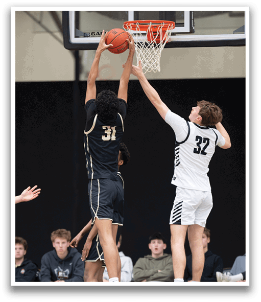 Two basketball players are leaping for the same ball, one wearing a black jersey and the other wearing a white jersey. AI generated content