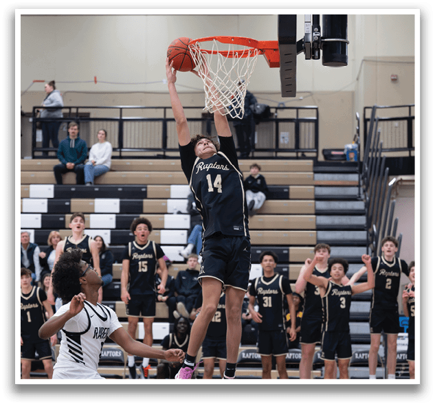 A basketball player is jumping to hit the ball, while a defender tries to block him. AI generated content