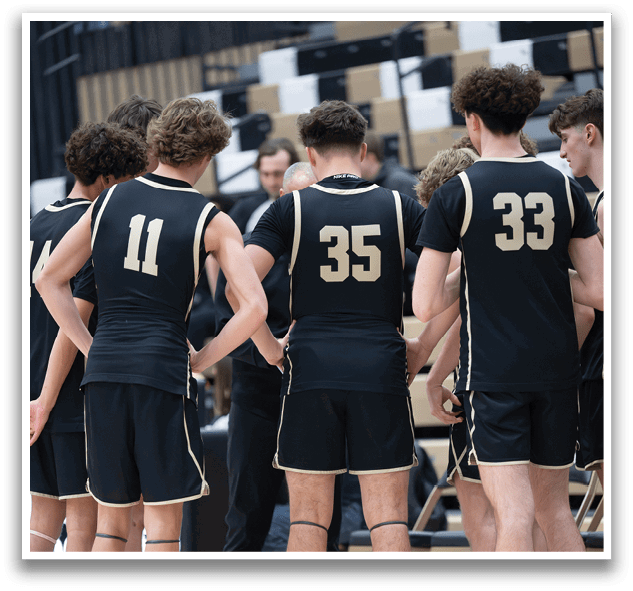 A group of young men wearing black and white uniforms are standing on a basketball court. AI generated content