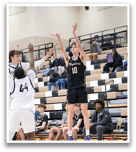 A basketball player in a black jersey shoots a basket while two other players try to block the shot. AI generated content