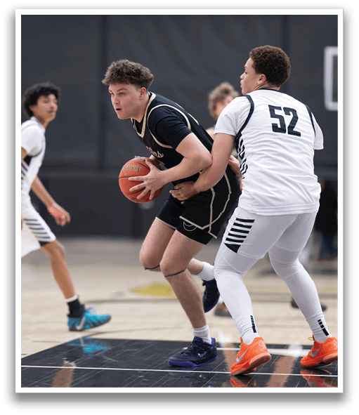 Two basketball players are fighting for the ball, one wearing a black shirt and the other wearing a white shirt. AI generated content