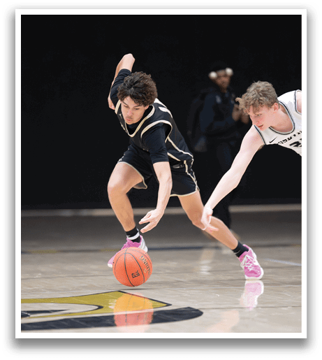 Two basketball players are running for the ball. One player is wearing a black shirt and the other is wearing a white shirt. AI generated content