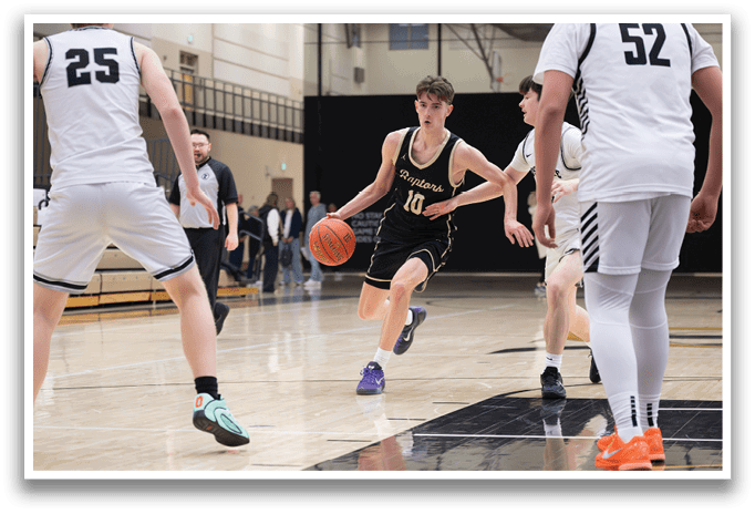 A basketball player in a black and gold uniform is running with a basketball in his hands. AI generated content