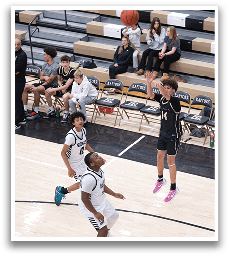 A basketball player is jumping in the air to catch a ball while other players watch. AI generated content