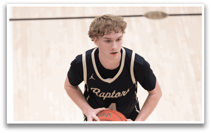 A basketball player wearing a black jersey with the word Raptors on it holds a basketball. AI generated content