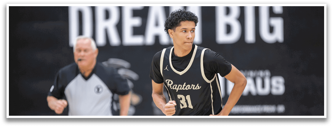 A man wearing a black jersey with the word “Capitals" on it is running on a basketball court. AI generated content