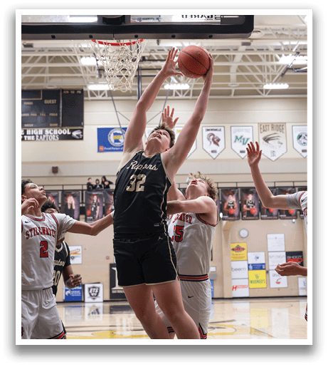 A basketball player leaps to block a shot, while his teammates look on. AI generated content