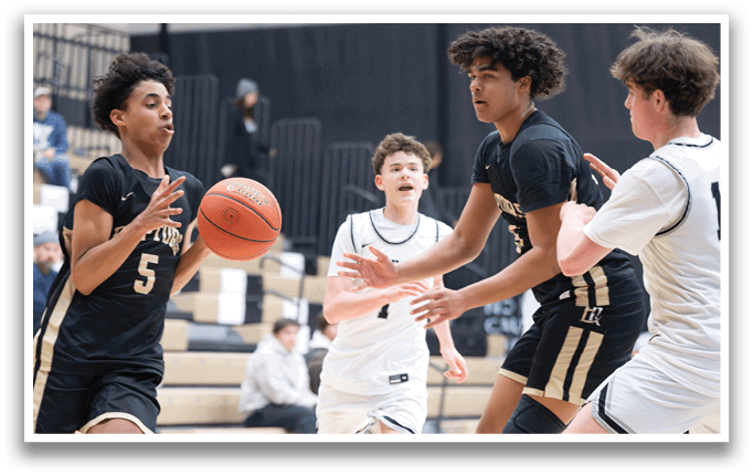 A group of young men playing basketball, with one player holding a basketball and others trying to block him. AI generated content