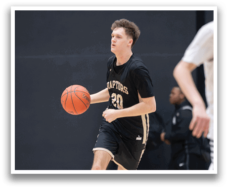 A basketball player in a black shirt and shorts is holding a basketball. AI generated content