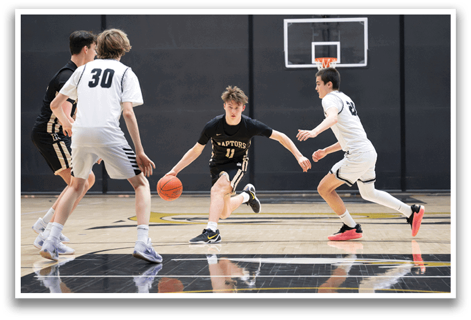 A group of young men playing basketball on a court. AI generated content