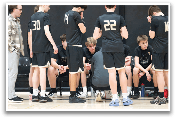 A group of young men wearing black shirts and shorts are sitting on a bench. AI generated content