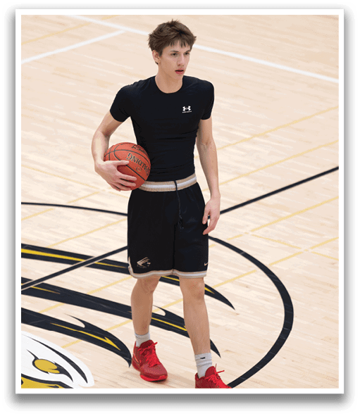 A man wearing a black shirt and black shorts is holding a basketball. AI generated content